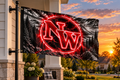 School flag mockup with both left grommets visibly clipped directly to the pole