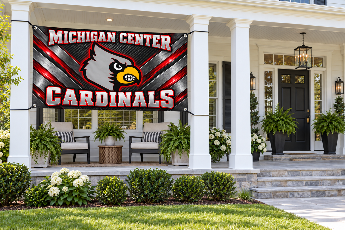 Michigan Center Cardinals Steel Cardinal Flags & Banners – 4 by 8 foot banner tied through four corner grommets in a side porch bay; front door and walkway clear