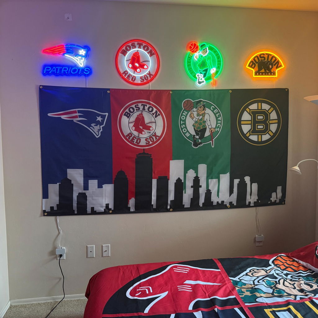 Customer photo of the Boston four-team skyline flag displayed on a bedroom wall