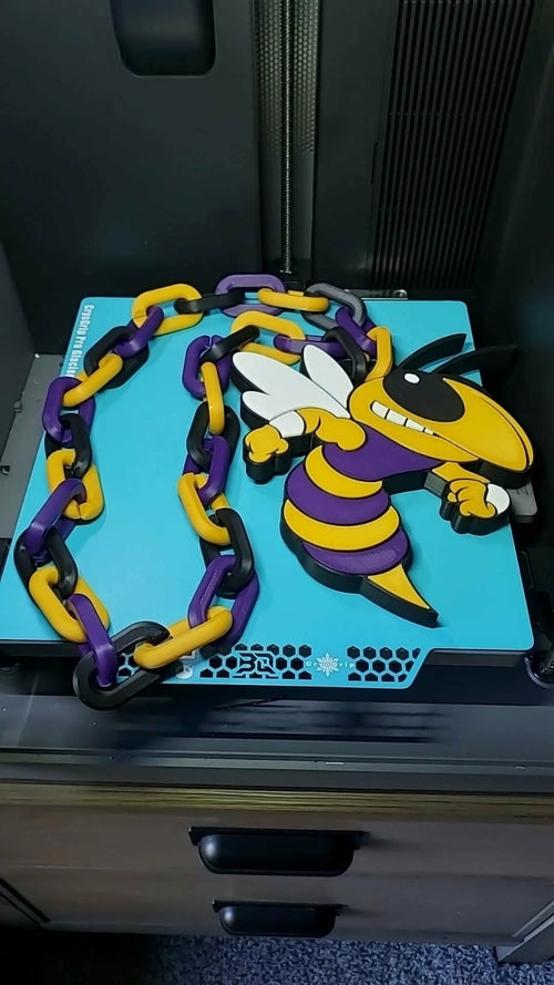 Concord Yellow Jackets 3D-printed mascot hype chain in purple, yellow, black and white with matching oversized links