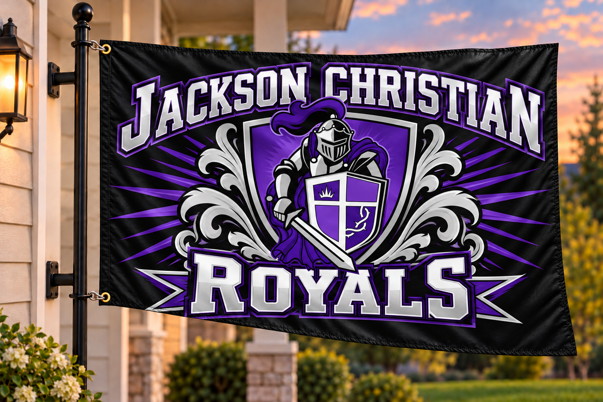 Jackson Christian Royals flag with both left grommets directly clipped to the house-mounted pole