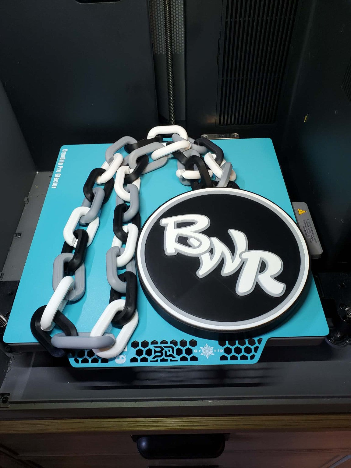 Custom BWR hype chain with a black and white round pendant and gray, white and black links