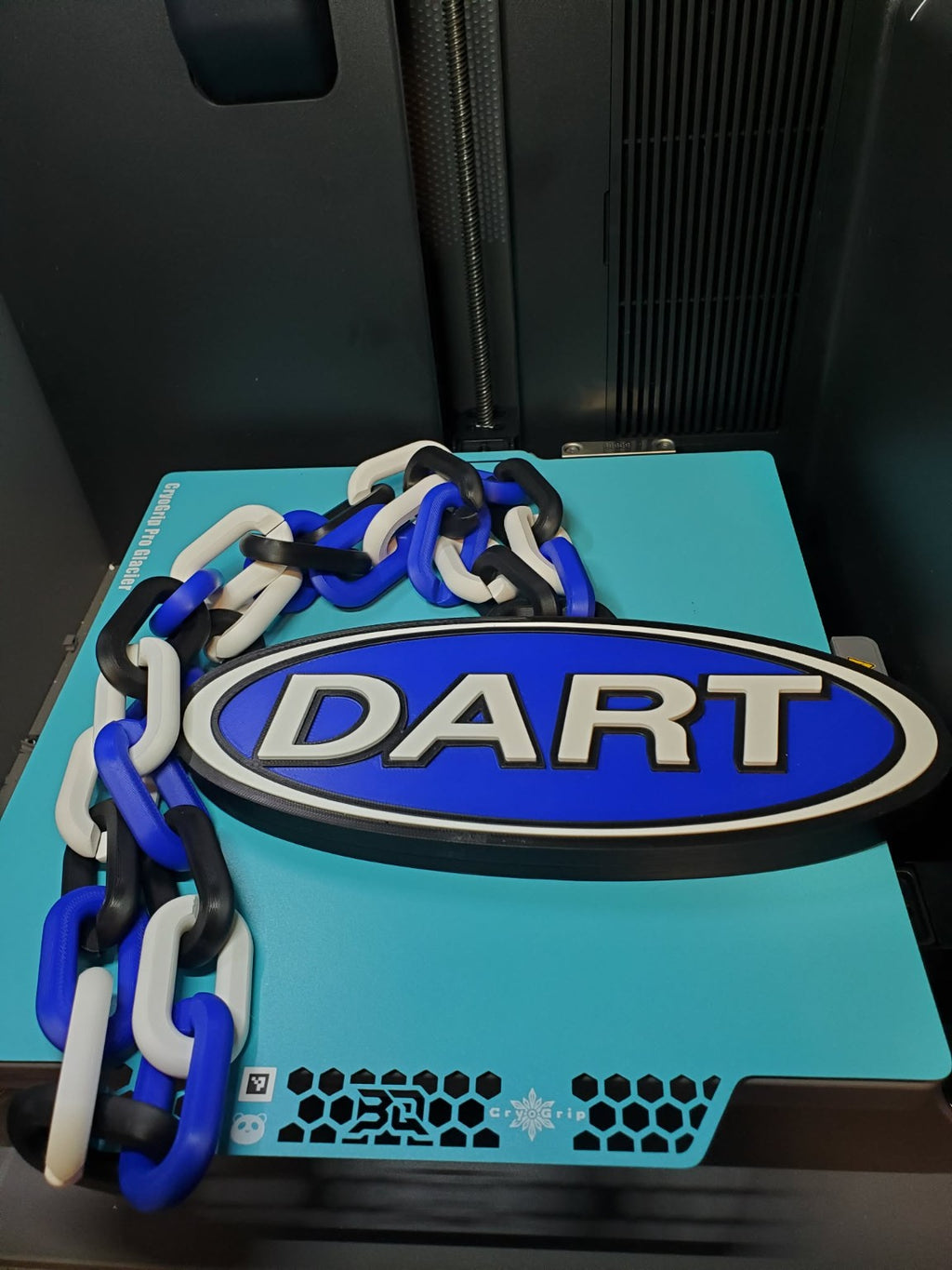 Custom DART hype chain with a blue oval pendant and blue, white and black links