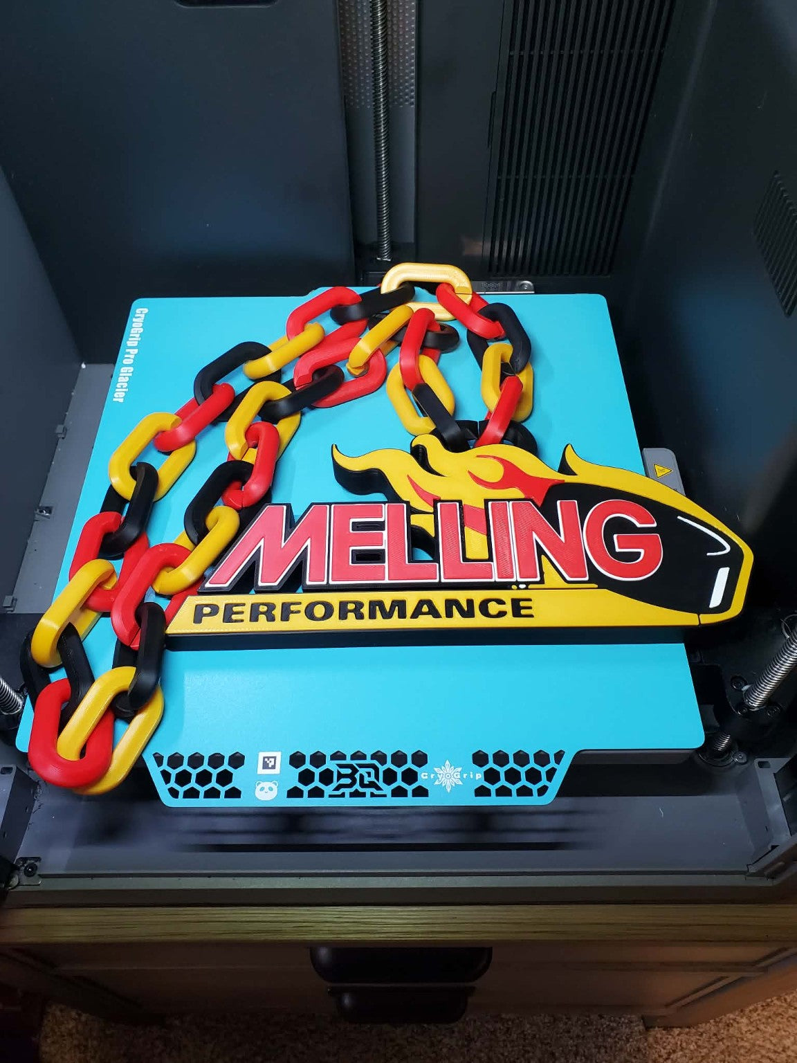 Custom 3D-printed Melling Performance hype chain with red, yellow and black links