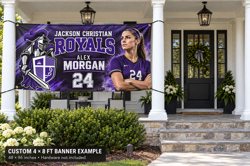 Jackson Christian Royals custom 4 by 8 foot banner example with photo, name and jersey number; four corner grommets secured between porch pillars beside an unobstructed entrance.