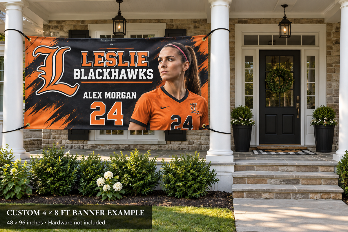 Leslie Blackhawks custom 4 by 8 foot banner example with photo, name and jersey number; four corner grommets secured between porch pillars beside an unobstructed entrance.