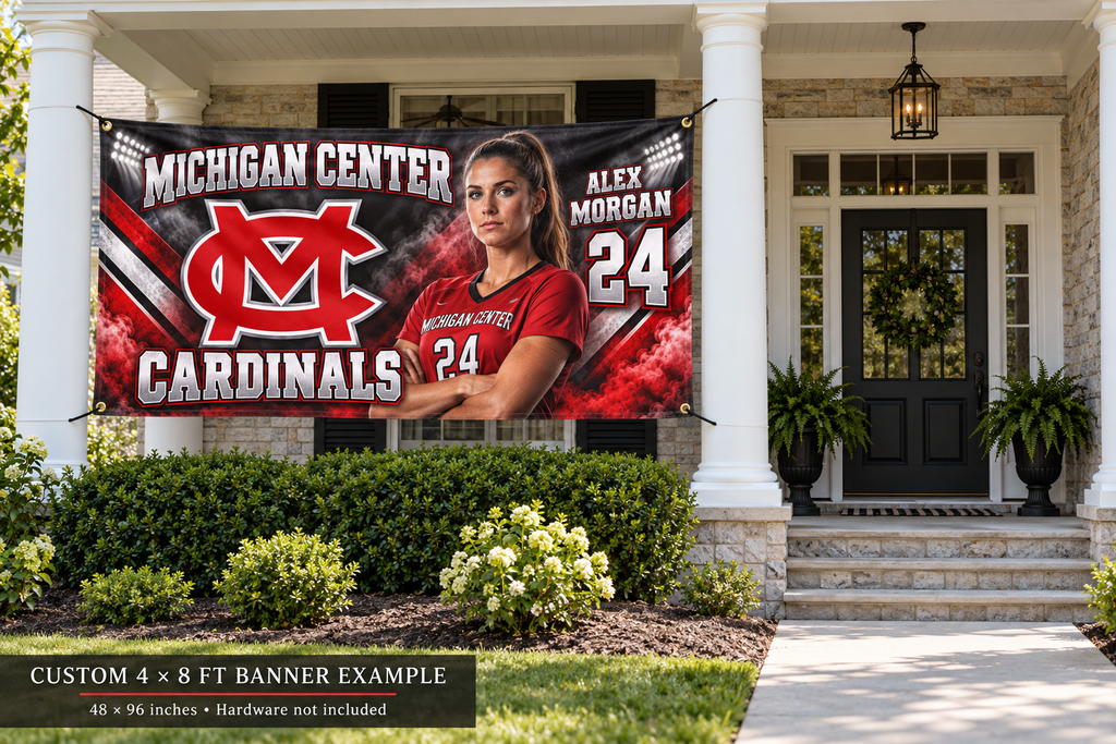 Michigan Center Cardinals custom 4 by 8 foot banner example with photo, name and jersey number; four corner grommets secured between porch pillars beside an unobstructed entrance.