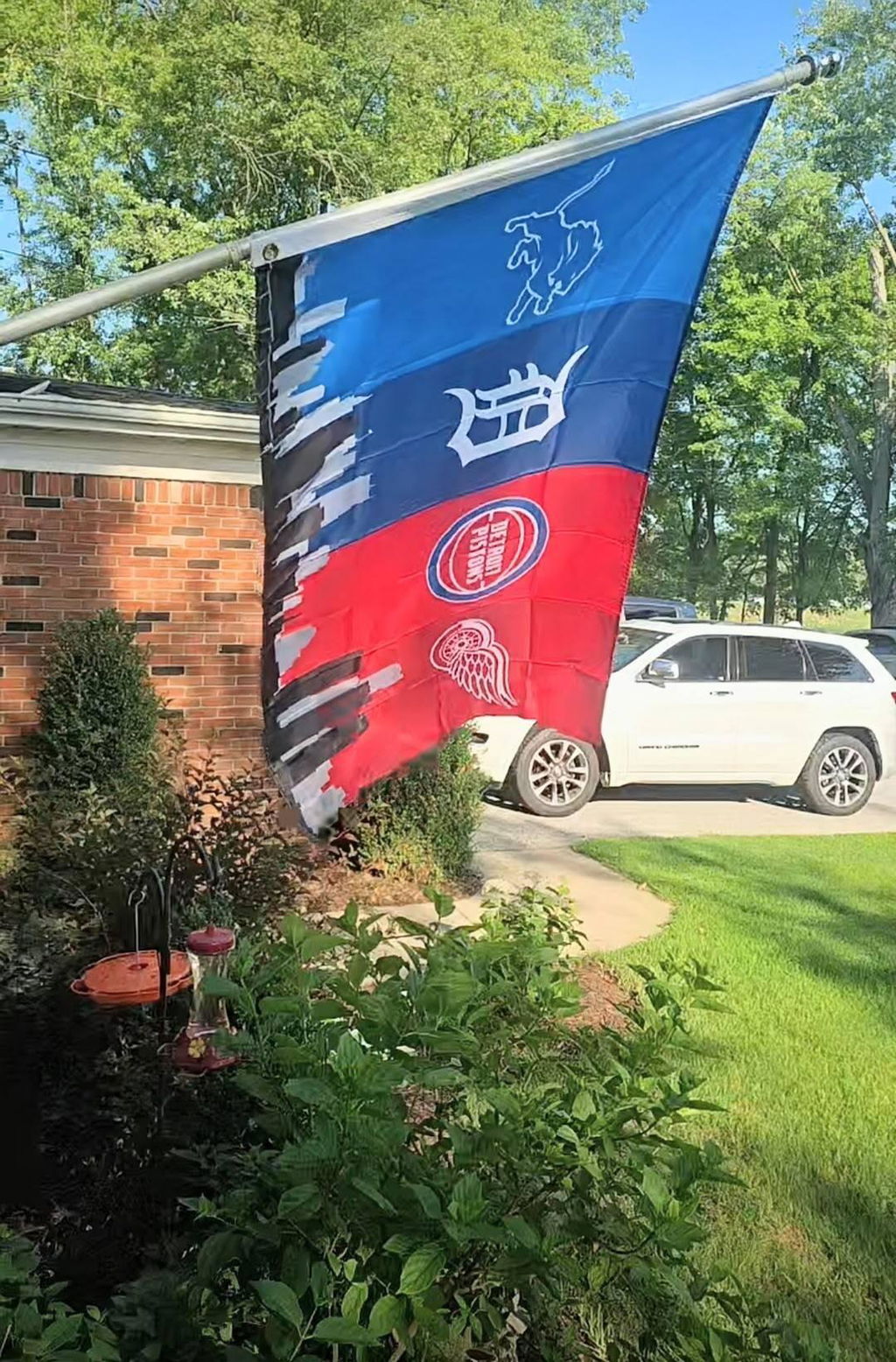 Customer photo of the Detroit four-team skyline flag flying on an angled pole