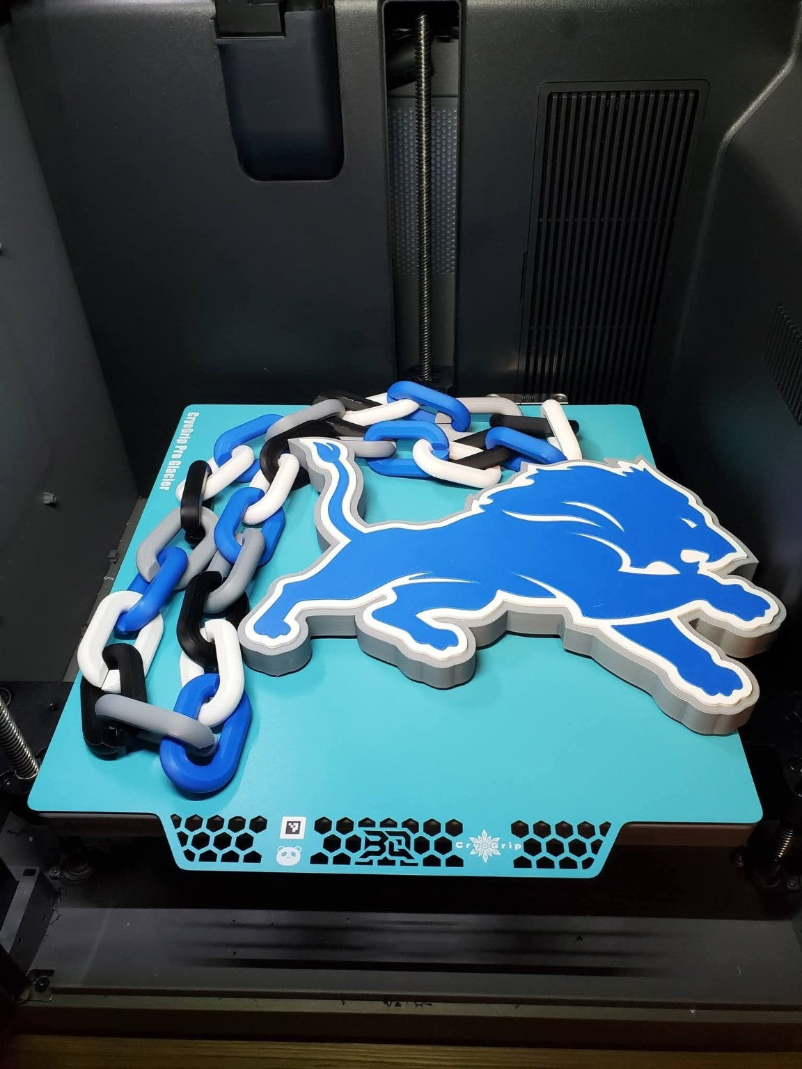 Actual Detroit Lions 3D-printed hype chain with blue lion pendant and blue, white and black links.