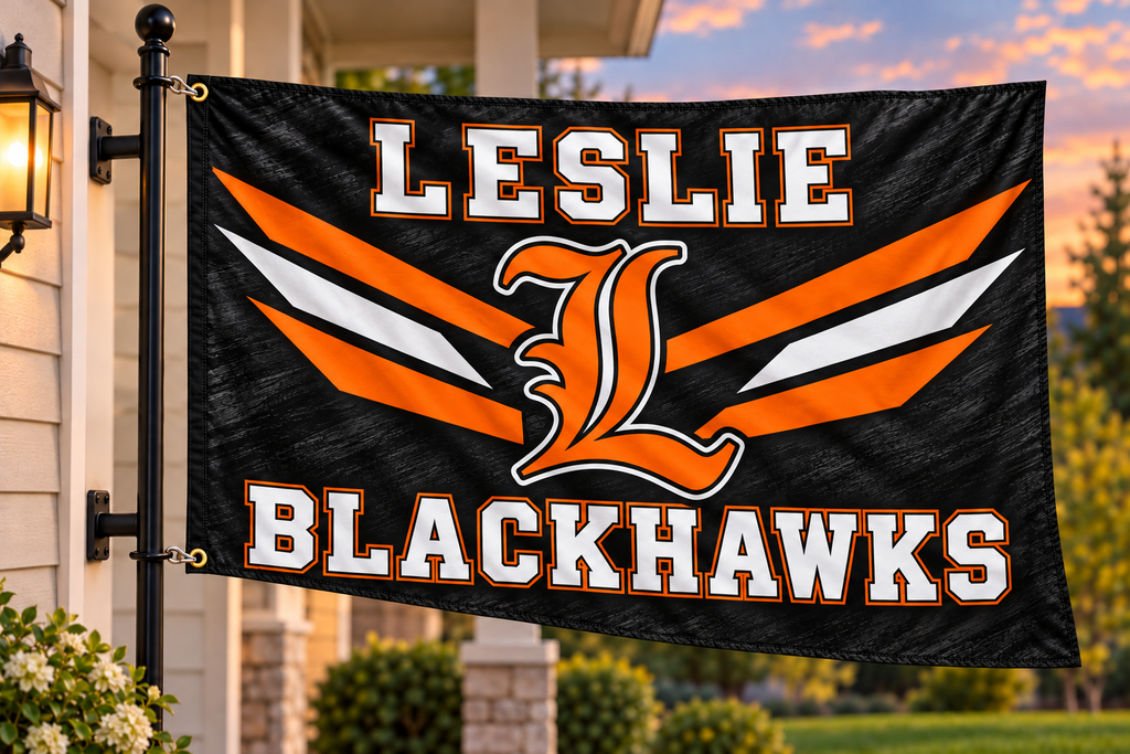 Leslie Blackhawks flag mockup with both left grommets clipped directly to house-mounted pole