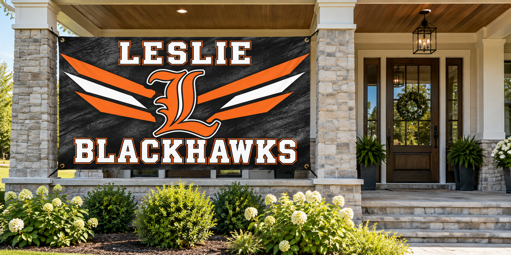 Leslie Blackhawks 4 ft by 8 ft banner mockup with four corner grommets in side porch bay, leaving entrance clear