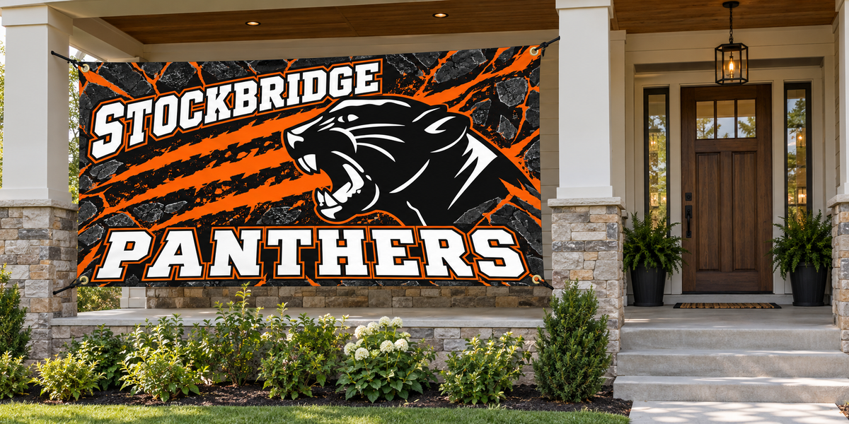 Stockbridge Panthers 4 by 8 foot banner tied through all four corner grommets beside an open entrance