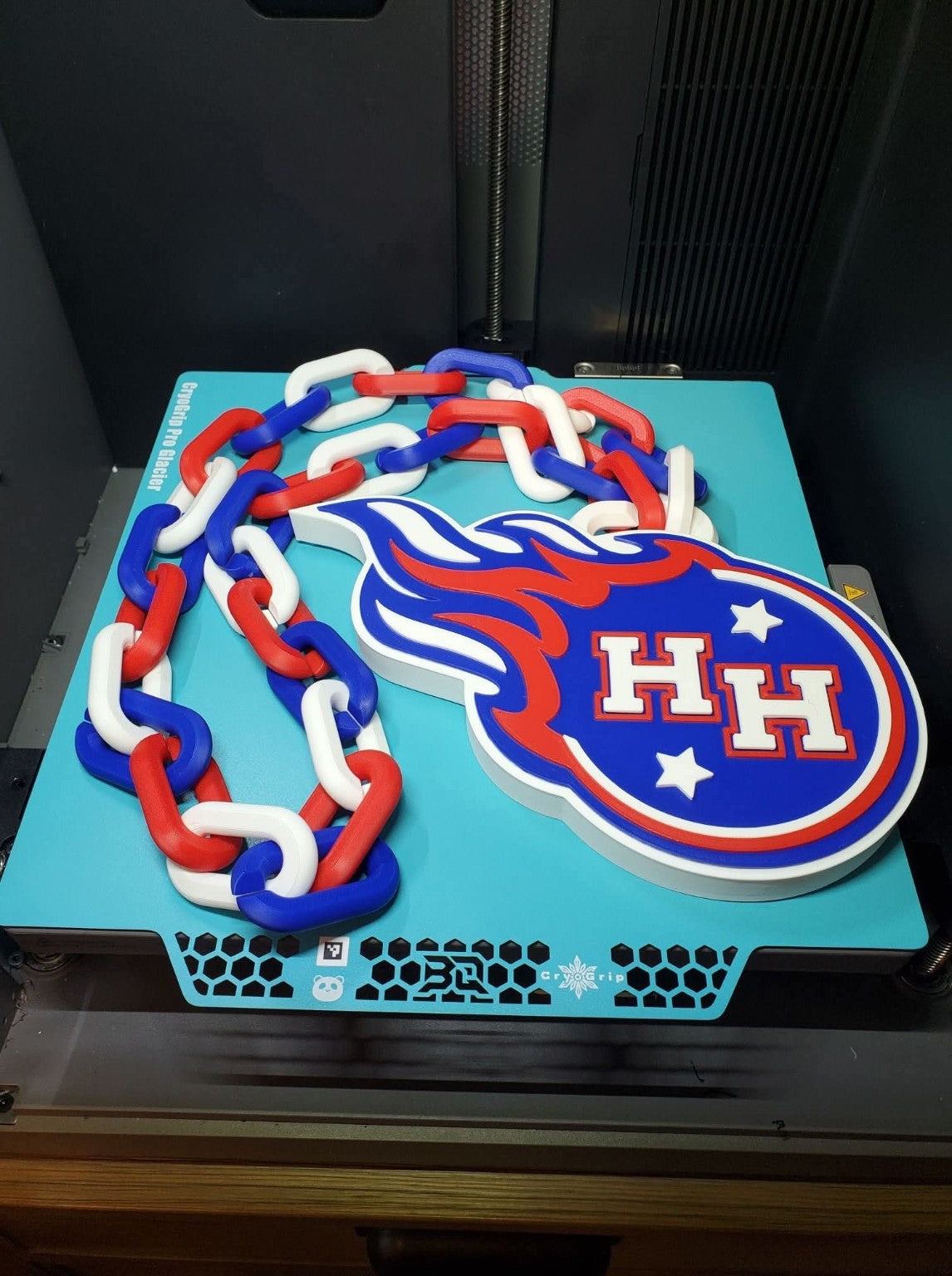 Actual Hanover Horton Comets 3D-printed hype chain with HH comet pendant and red, white and blue links.