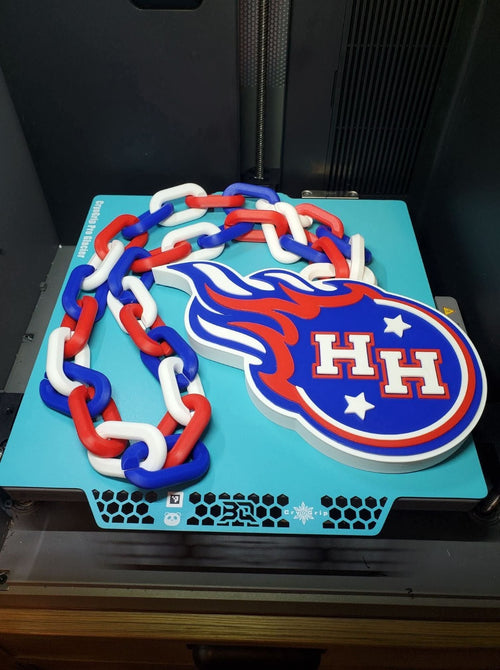 Actual Hanover Horton Comets 3D-printed hype chain with HH comet pendant and red, white and blue links.