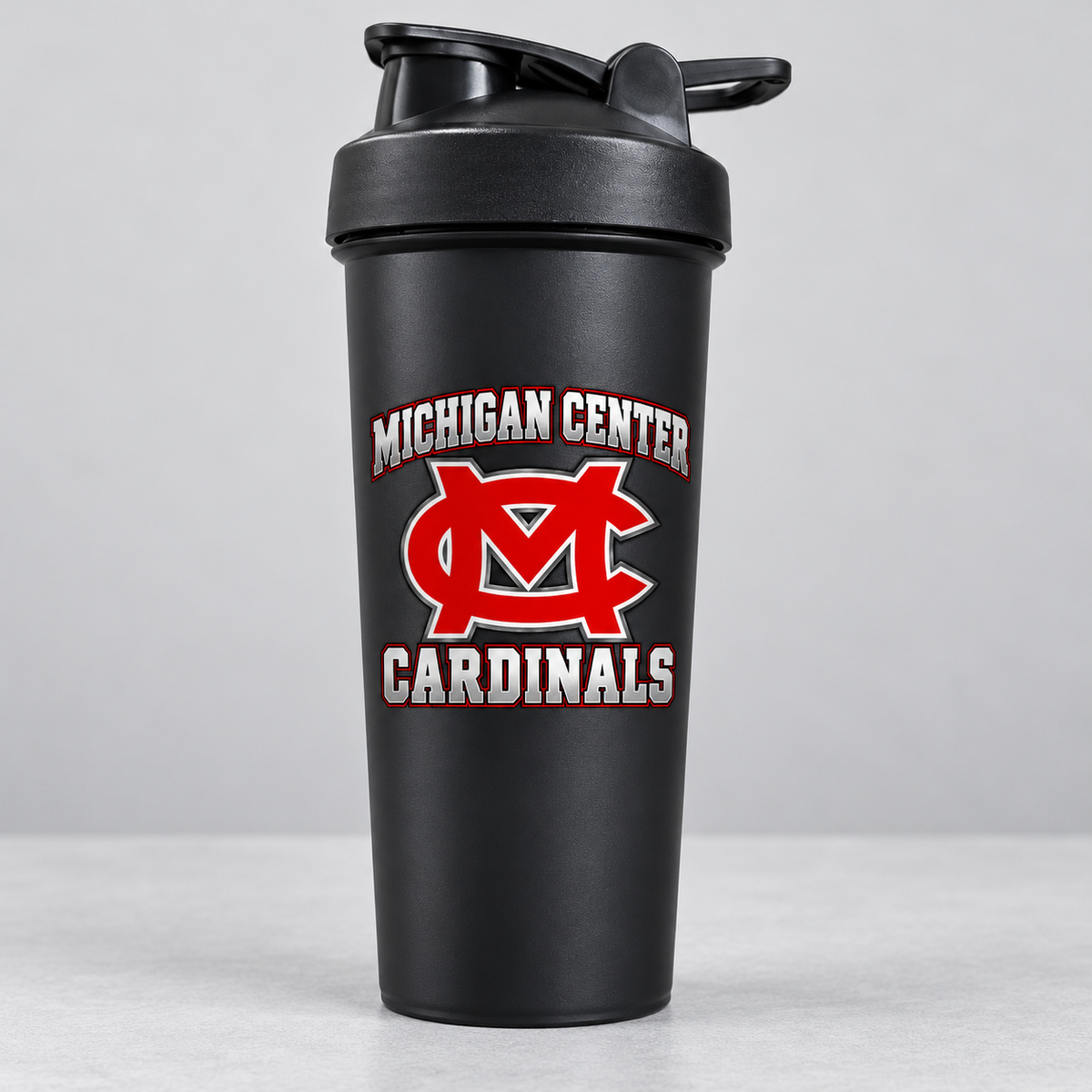 Michigan Center Cardinals black shaker cup — one cup shown from the bulk pack of 120