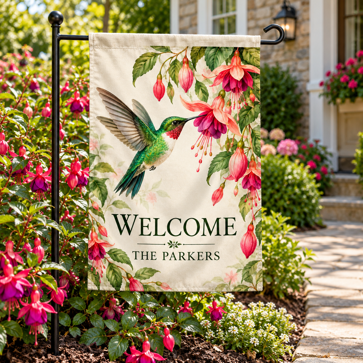 Personalized Hummingbird Garden Flag | 18 × 12 in shown on a garden flag stand — realistic product mockup