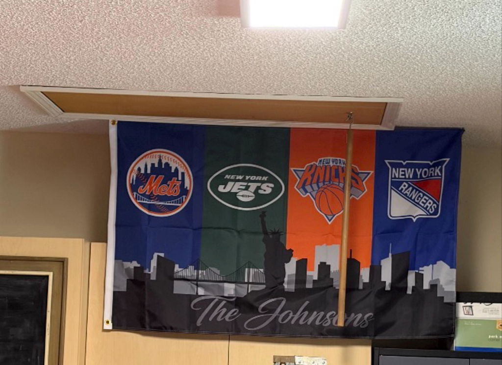 Customer photo of a personalized New York sports flag with a family name
