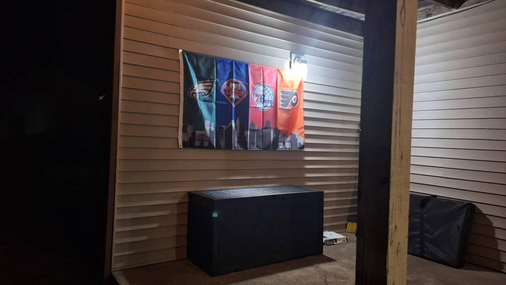Customer photo of the Philadelphia four-team skyline flag on a covered patio