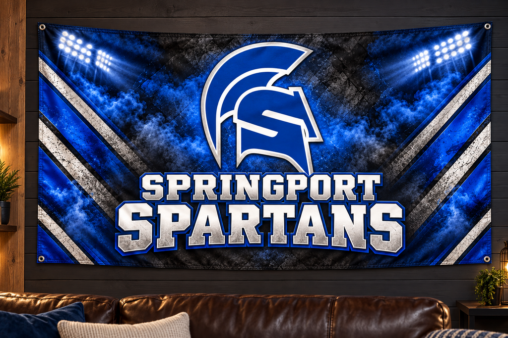 Springport Spartans Spartan Pride fabric banner displayed on a game room wall